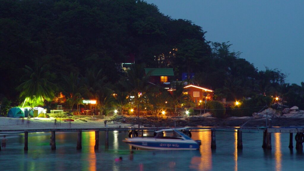 Koh Tao — The Vacation That Taught Me How I Like to Travel 7 Tropical beach at night with lights reflecting on water wallpaper
