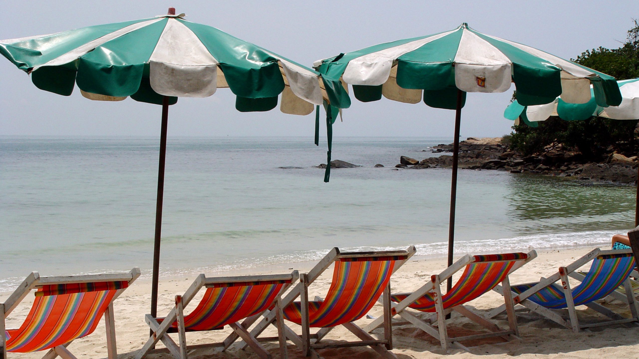 Beach Chairs Under Umbrellas – Coastal Relaxation