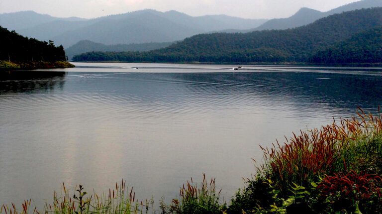 Misty Lake with Mountain Reflections 4K Wallpaper