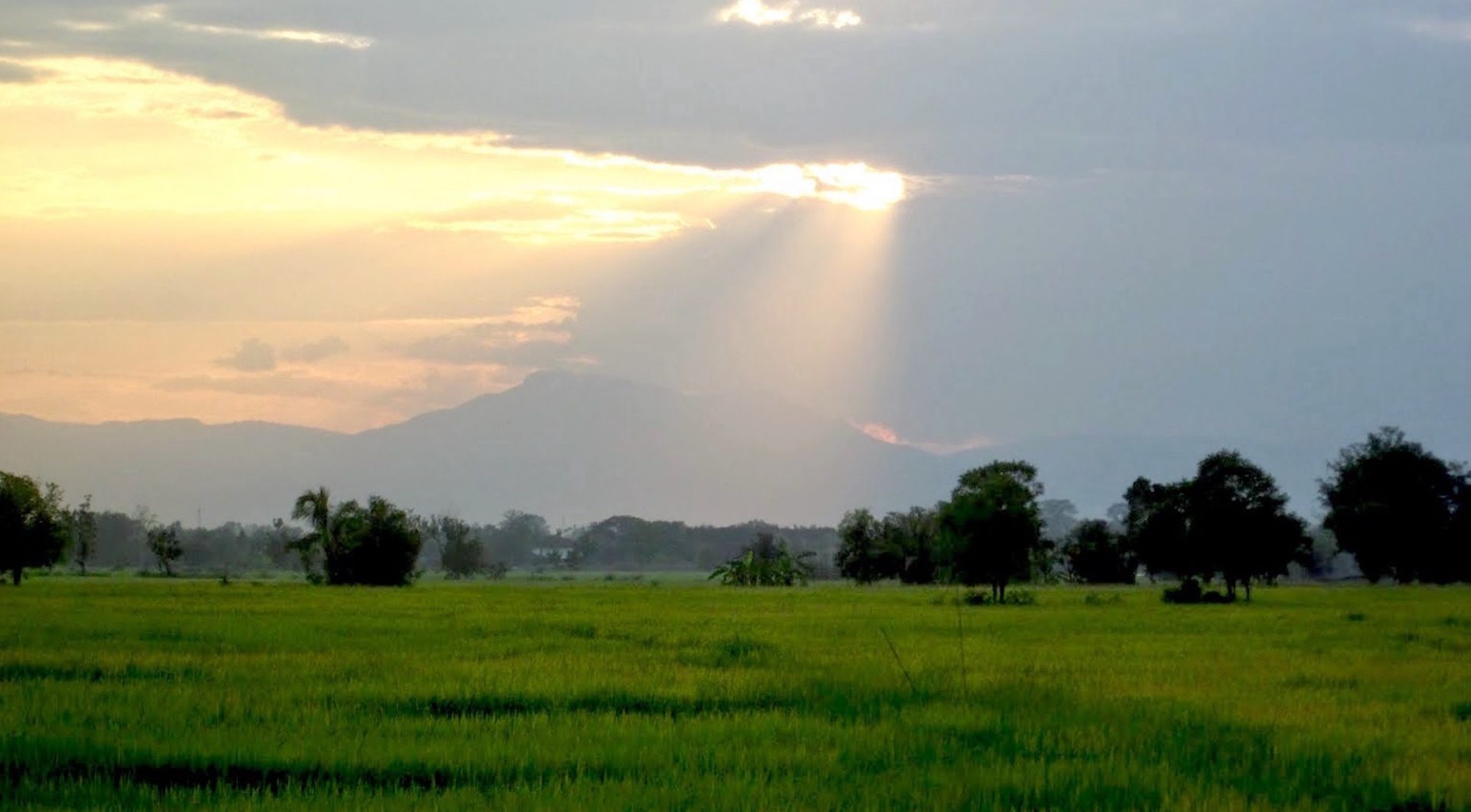 Sunbeams Over Green Field and Mountain – Thailand Landscape HD Wallpaper