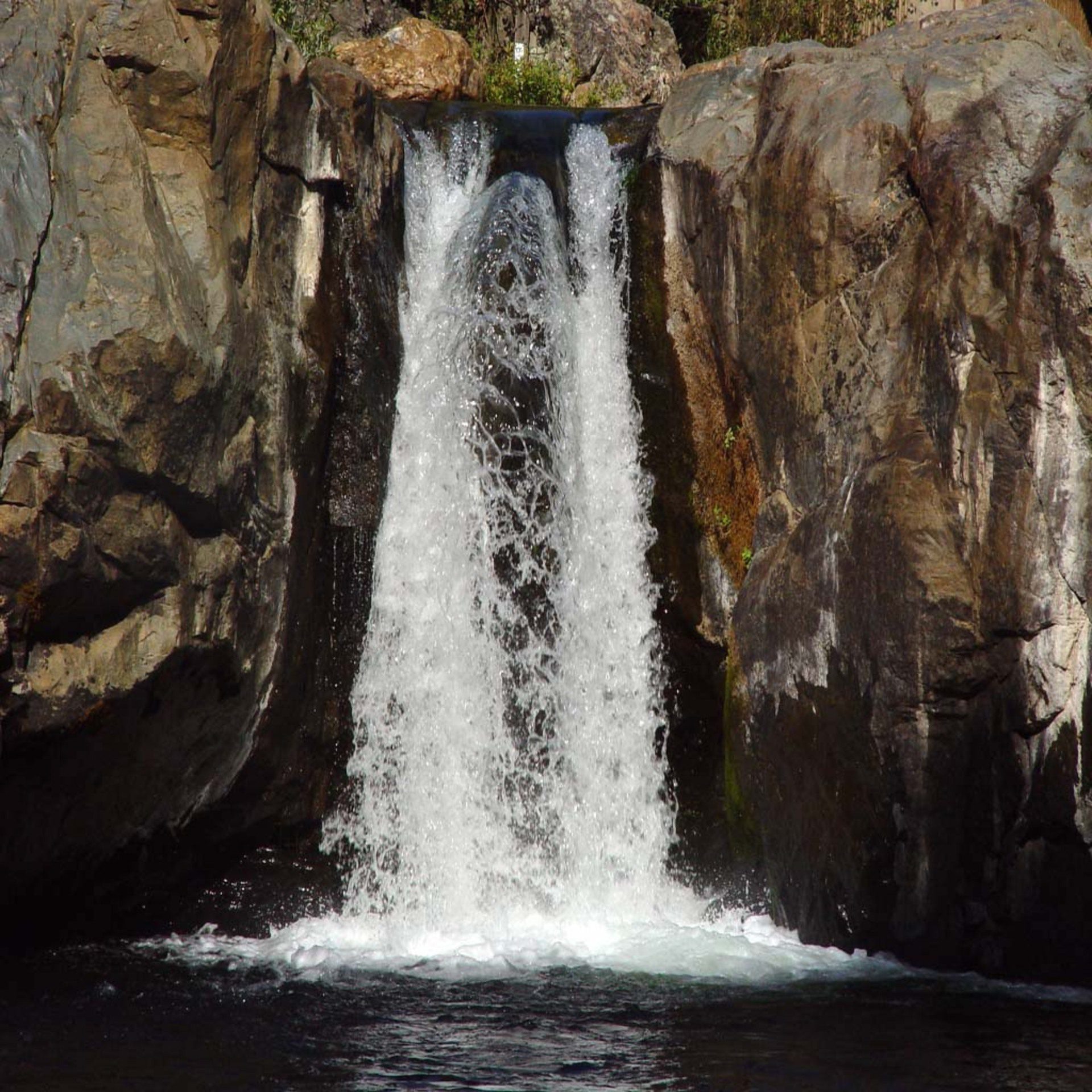 Waterfall Cascading Between Rocks Wallpaper