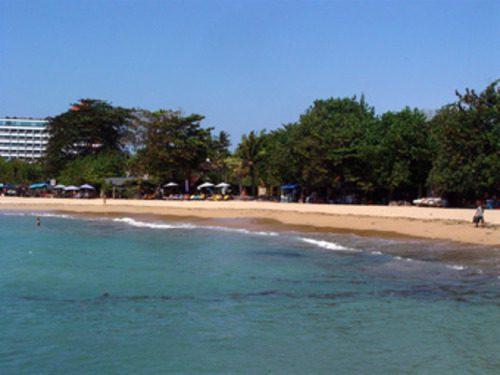 Wide view of Sanur Beach coastline with calm tropical water