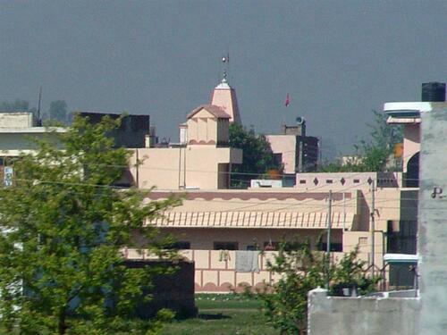 Temple rising above homes and buildings in northern India.
