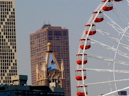 The Navy Pier Ferris Wheel rising above downtown Chicago.