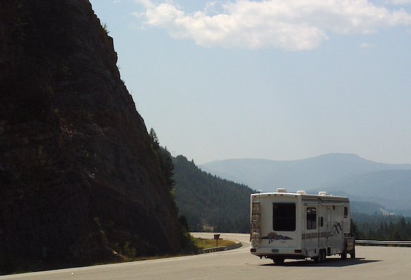 An RV traveling along a mountain highway in Montana on the way to Yellowstone National Park.