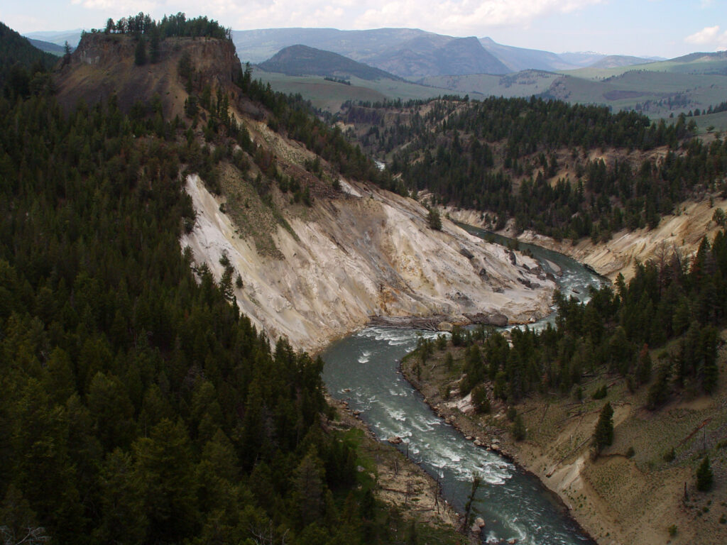 View of Calcite Canyon and the Yellowstone River winding through rugged cliffs.